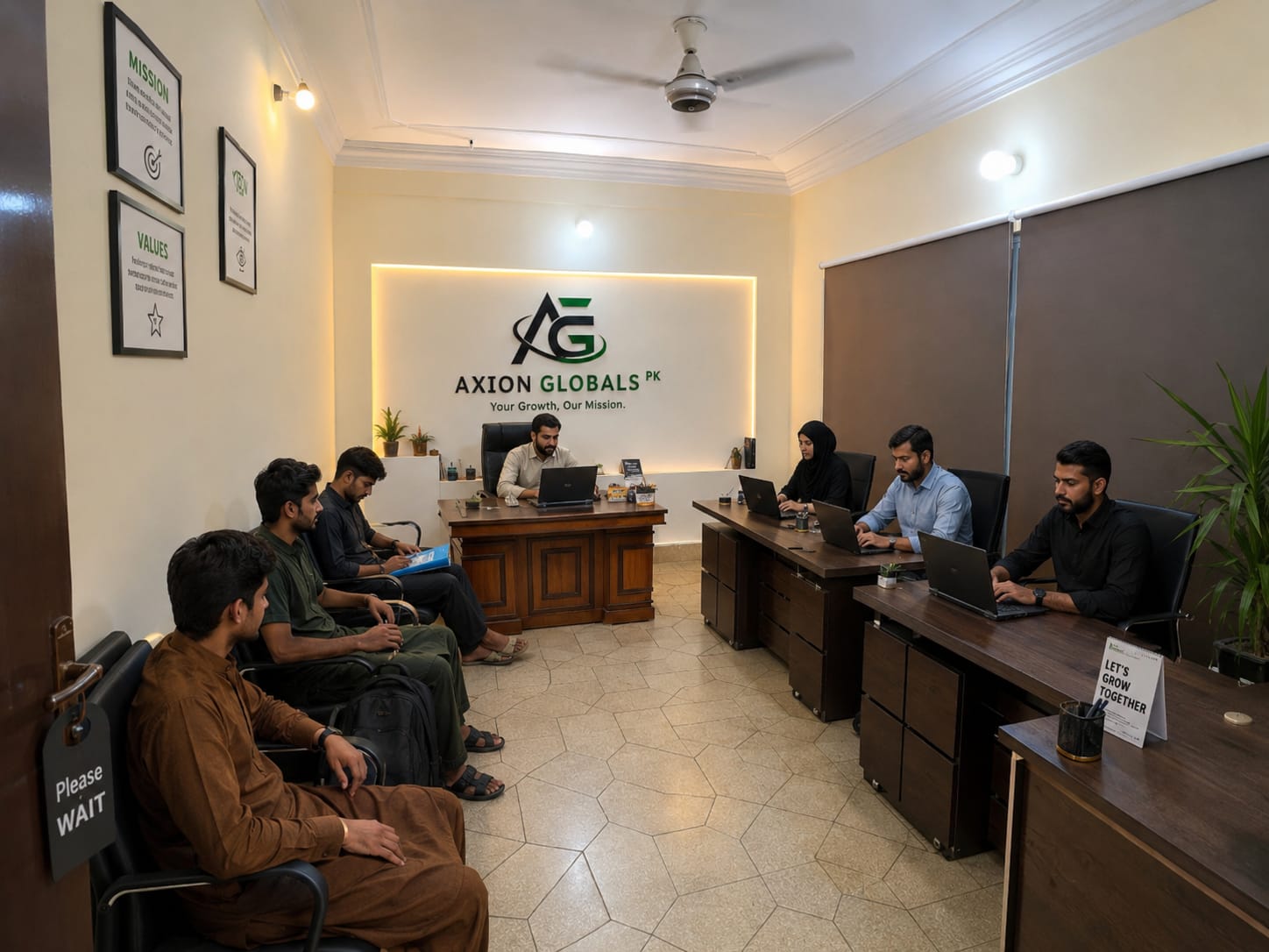 The AXION GLOBALS PK team working at their desks in our Lahore office